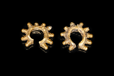 Three Vietnamese golden earrings, Champa, 14th C. and a pair of later Chinese gilded earrings, 18/19th C.
