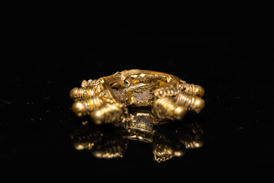 Three Vietnamese golden earrings, Champa, 14th C. and a pair of later Chinese gilded earrings, 18/19th C.