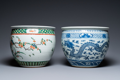A Chinese blue and white 'dragons' fish bowl and a famille verte 'magpies' fish bowl, 19th C.