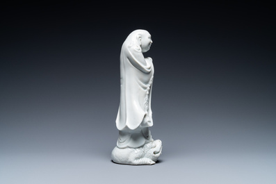A Chinese Dehua blanc de Chine figure of Liu Hai with the toad, Kangxi