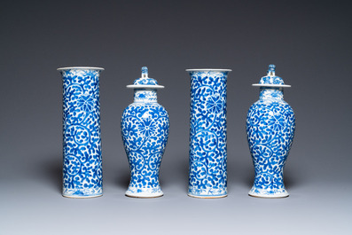 A Chinese blue and white four-piece garniture, Kangxi mark, 19th C.