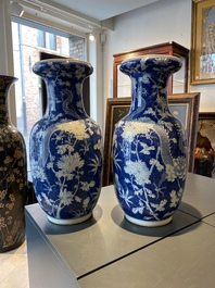 A pair of Chinese blue and white 'dragon and peony' vases, 19th C.