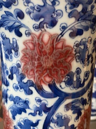 A Chinese blue, white and copper-red 'gu' vase with lotus scrolls, Kangxi