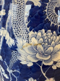 A pair of Chinese blue and white 'dragon and peony' vases, 19th C.
