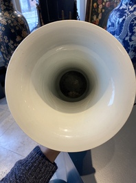 A Chinese blue, white and copper-red 'gu' vase with lotus scrolls, Kangxi