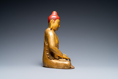 A Vietnamese or Japanese gilded and lacquered wooden Buddha, 19th C.