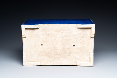 A Chinese rectangular blue-glazed jardini&egrave;re on wooden stand, 19th C.