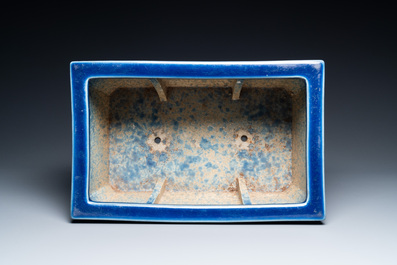 A Chinese rectangular blue-glazed jardini&egrave;re on wooden stand, 19th C.