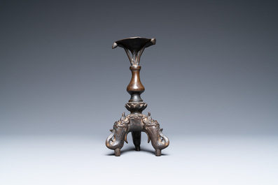 A Chinese bronze candlestick, Ming