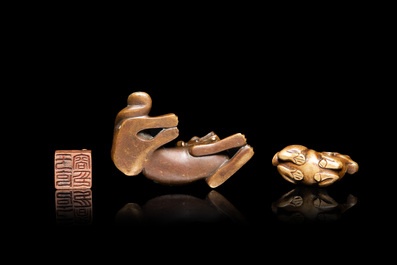 Two Chinese bronze scroll weights and a seal stamp, Qing