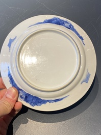 A Chinese blue and white plate with two men in a landscape, Kangxi