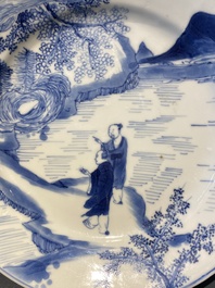 A Chinese blue and white plate with two men in a landscape, Kangxi