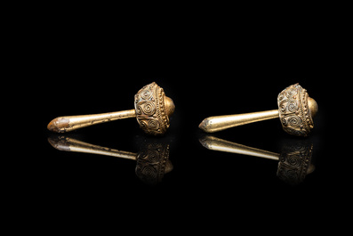 Three Vietnamese golden earrings, Champa, 14th C. and a pair of later Chinese gilded earrings, 18/19th C.