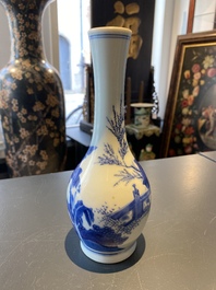 A Chinese blue and white bottle vase with a lady and her servant in a landscape, Transitional period