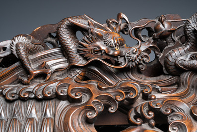 A large Japanese wooden screen with a central gilt-lacquered and ivory-inlaid panel, Meiji