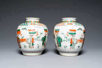 A pair of Chinese famille verte vases on wooden stands, 'hare' mark, 19th C.