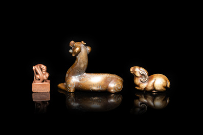 Two Chinese bronze scroll weights and a seal stamp, Qing