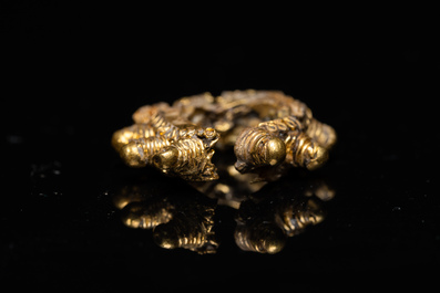 Three Vietnamese golden earrings, Champa, 14th C. and a pair of later Chinese gilded earrings, 18/19th C.