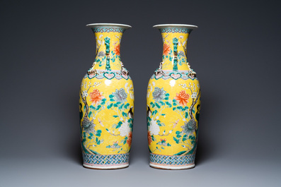 A pair of Chinese yellow-ground famille rose vases, 19th C.