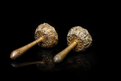 Three Vietnamese golden earrings, Champa, 14th C. and a pair of later Chinese gilded earrings, 18/19th C.
