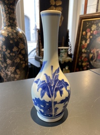 A Chinese blue and white bottle vase with a lady and her servant in a landscape, Transitional period