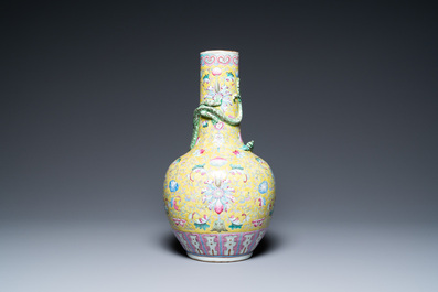 A Chinese yellow-ground famille rose bottle vase, 19th C.