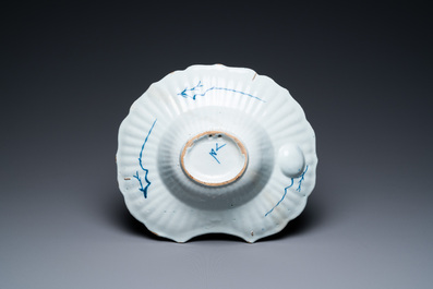 A gadrooned Dutch Delft blue and white shaving bowl, 18th C.