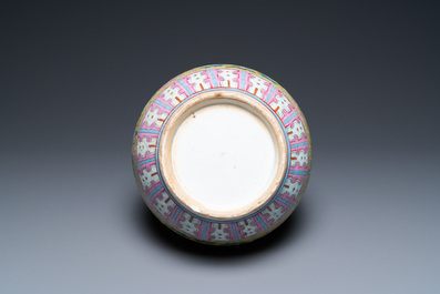 A Chinese yellow-ground famille rose bottle vase, 19th C.