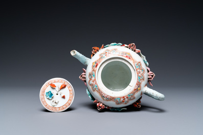 A Chinese famille rose teapot with applied floral design, Yongzheng
