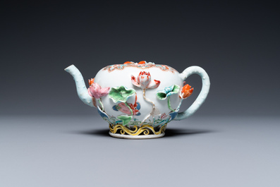 A Chinese famille rose teapot with applied floral design, Yongzheng