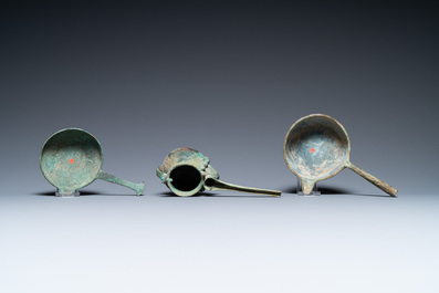 Two Luristan bronze pouring bowls and a spouted vessel, Iran, 1st millenium BC