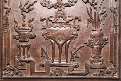 A Chinese carved wooden 'antiquities' panel, 19th C.