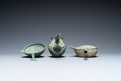 Two Luristan bronze pouring bowls and a spouted vessel, Iran, 1st millenium BC