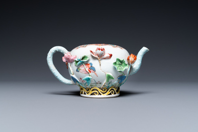 A Chinese famille rose teapot with applied floral design, Yongzheng