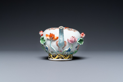 A Chinese famille rose teapot with applied floral design, Yongzheng
