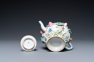A Chinese famille rose teapot with applied floral design, Yongzheng