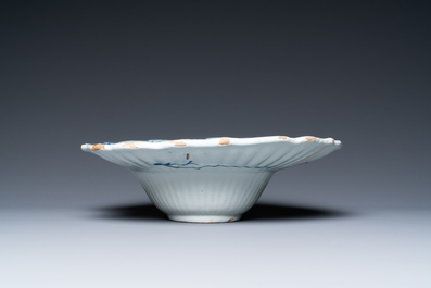 A gadrooned Dutch Delft blue and white shaving bowl, 18th C.