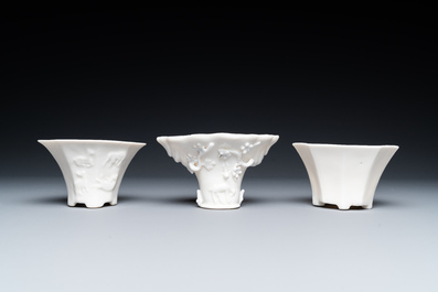 Two pairs of Chinese Dehua blanc de Chine joss stick holders, three libation cups and four figures, Kangxi and later