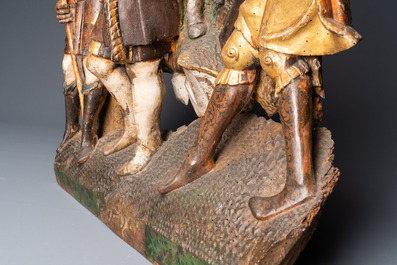 A polychromed walnut wood retable fragment depicting soldiers, Spain, 1st half 16th C.