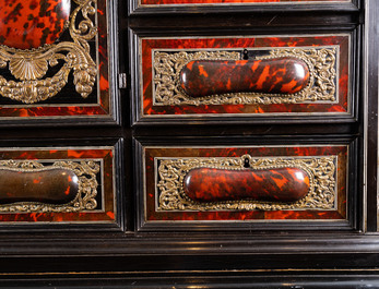 A tortoise veneer, gilt copper, ebony and ebonised wooden mirrored interior cabinet on stand, Antwerp, 17th C.