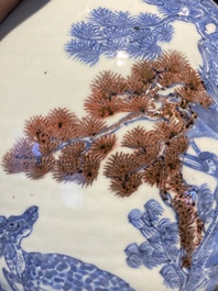 A Chinese blue, white and copper-red bottle vase with a deer and birds among blossoming branches, Daoguang