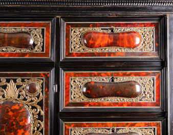 A tortoise veneer, gilt copper, ebony and ebonised wooden mirrored interior cabinet on stand, Antwerp, 17th C.