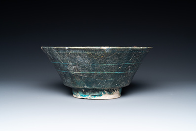 A turquoise- and black-glazed bowl, Kashan, Iran, 12/13th C.