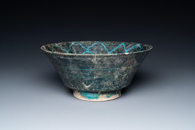 A turquoise- and black-glazed bowl, Kashan, Iran, 12/13th C.