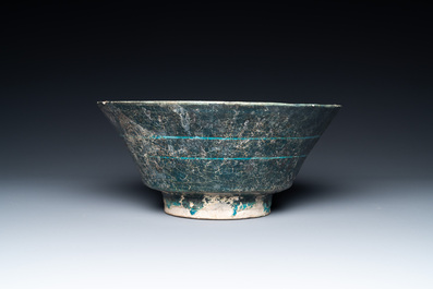 A turquoise- and black-glazed bowl, Kashan, Iran, 12/13th C.