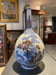 A Chinese blue, white and copper-red bottle vase with a deer and birds among blossoming branches, Daoguang