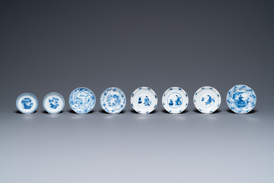 Twenty-seven Chinese blue and white saucers and seven cups, Kangxi and later