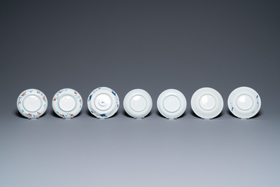 Twenty-seven Chinese blue and white saucers and seven cups, Kangxi and later