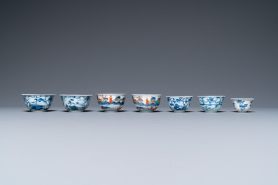 Twenty-seven Chinese blue and white saucers and seven cups, Kangxi and later