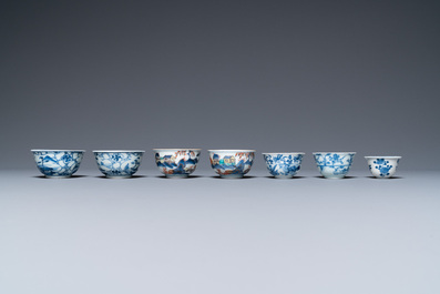 Twenty-seven Chinese blue and white saucers and seven cups, Kangxi and later